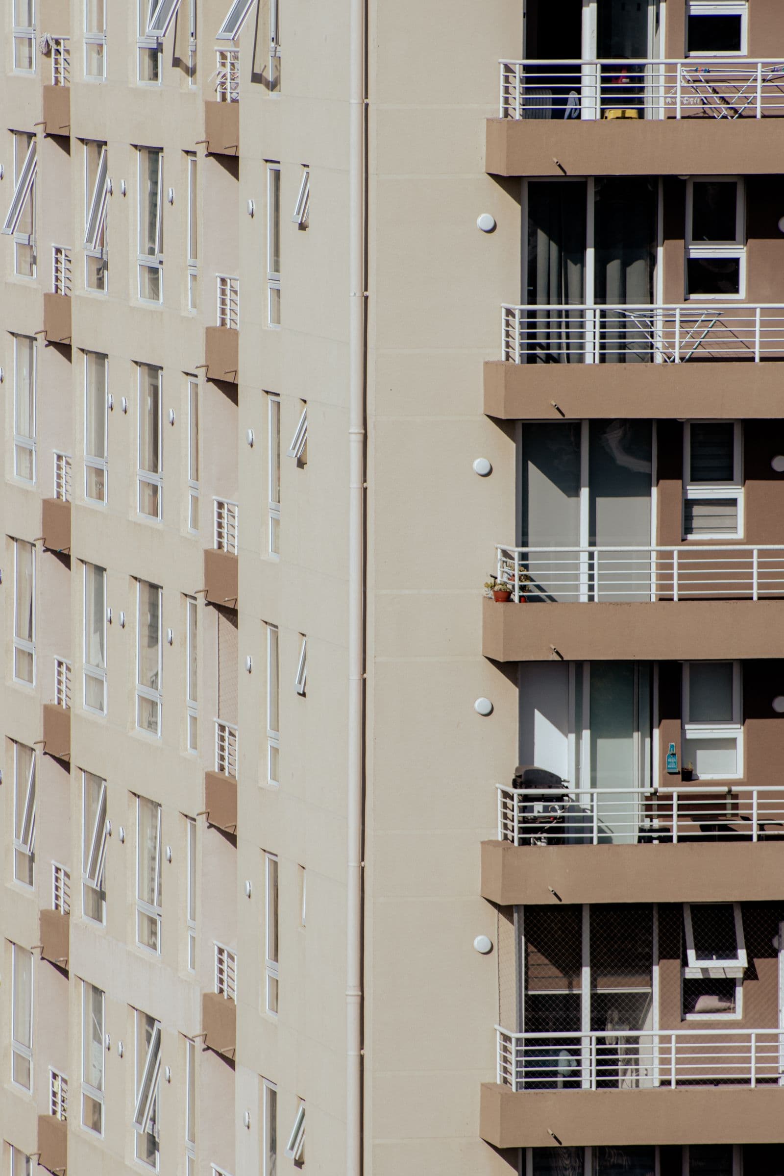 Stacked balconies across the face of an apartment block